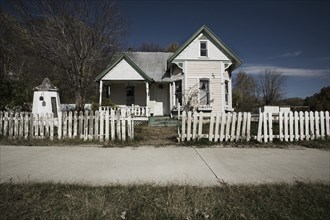 Rundown House With Picket Fence and Overgrown Lawn, Grafton, Illinois, USA