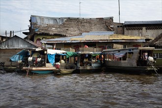 Boats Moored at House in Floating City, Iquitos, Peru