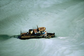 Tugboat in Icy Water, High Angle View