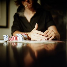 Young Gambling Man Playing Poker
