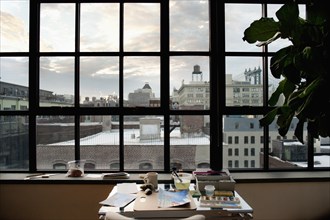 Artist's Desk and View of Urban Cityscape, Brooklyn, New York City, USA