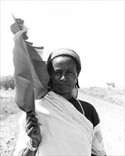 Ethiopian Woman in Robe with Leaf