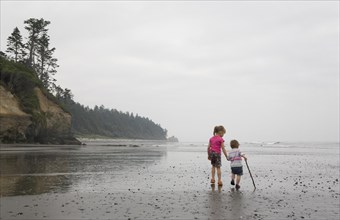 Two Little Girls Walking on Beach