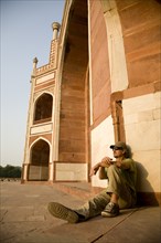 Man Sitting Against Humayun's Tomb, New Delhi, India