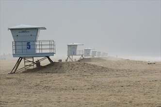 Lifeguard Towers on Foggy Beach, Huntington Beach, California, USA