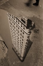 Flatiron Building Reflection in Puddle, New York City, USA