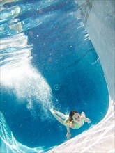 Girl Underwater in Pool After Diving