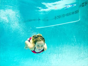 Girl Swimming Underwater in Pool, Eye Contact 2