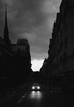 Lone Car on Narrow Street at Night, Paris, France