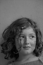 Young Smiling Girl with Makeup Dots on Cheeks, Portrait,