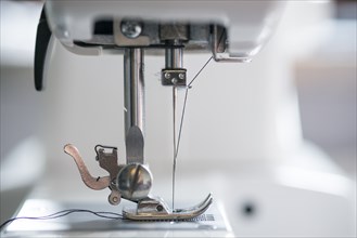 Sewing Machine Mechanism with Thread Passing Through Needle