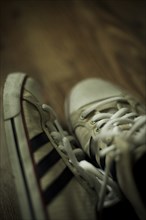 Pair of Sneakers on Floor, Close-Up