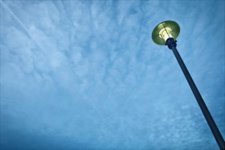 Street Light Against Blue Sky With Clouds