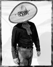 Mexican Cowboy With Large Brim Hat Looking Down