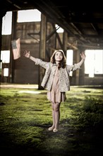 Young Girl Dancing in Abandoned Warehouse