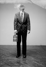 Man in Suit withCan of Gasoline