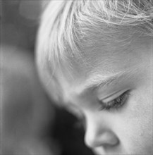 Young Boy Looking Down, Close-Up Profile