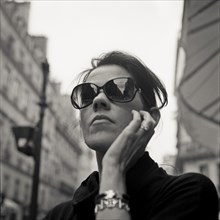 Woman Wearing Dark Sunglasses, Portait, Low Angle View, Paris, France