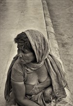 Woman Beggar on Sidewalk, India
