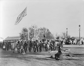 Ghost Dance, Cheyennes & Arapahoes in Circle around Flagpole, Indian Congress of the Trans-Mississippi and International Exposition, by Adolph F. Muir, F.A. Rinehart, 1898