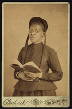 Three-quarter Length Portrait of African American Woman Posed with Book, by Harriet L. Bostwick, William A. Gladstone Collection of African American Photographs, 1880's