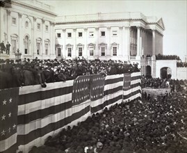 Chief Justice Morrison R. Waite administering the oath of office to James A. Garfield on the east portico of the U.S. Capitol, Washington DC, USA, Photograph by George Prince,  March 4, 1881