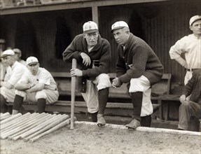 Grover Cleveland Alexander & Manager Pat Moran, in background are Joe Oeschger, Possum Whitted, & Milt Stock, Philadelphia Phillies, Bain News Service, 1915