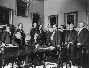 U.S. President William McKinley Looks on as Peace Protocol is Signed, Leading to the end of the Spanish-American War, Washington DC, USA, Francis Benjamin Johnston, August 12, 1898