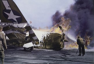 U.S. Soldier trying to Extinguish Flames of Burning Republic P-47 Fighter Plane on Ground during Invasion of Normandy, Cotentin Peninsula, France, June 1944