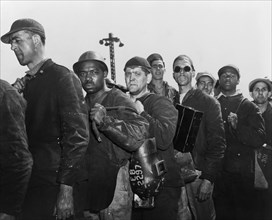 Group of Construction Workers engaged in Building Liberty Ship Frederick Douglass, Bethlehem-Fairfield Shipyards, Baltimore, Maryland, USA, Roger Smith, U.S. Office of War Information, May 1943