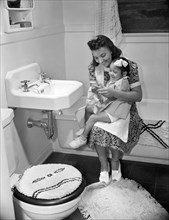 Mother and Daughter in Bathroom, Frederick Douglass Housing Project, Anacostia Neighborhood, Washington DC, USA, Photograph by Gordon Parks, July 1942