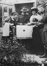 American Army Lieutenant Robert E. Lee Supervising the Packing of Red Cross Care Package by Women of the American Red Cross Care Committee, Newcastle, England, UK, Photograph by American National Red ...