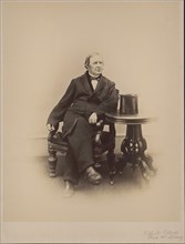 Hugh McCulloch (1808-95), American Statesman and U.S. Treasury Secretary, Full-Length Seated Portrait, Photograph by Alexander Gardner, 1865