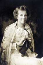 Edith Roosevelt (1861-1948), First Lady of the United States 1901-1909 as Wife of U.S. President Theodore Roosevelt, Seated Portrait Knitting, 1917