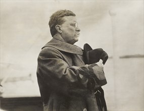 Theodore Roosevelt, half-length portrait, facing right holding hat over heart, Saluting while passing through line of Norwegian Battleships, on Board Queen Maud, during Visit to Norway, American Press...