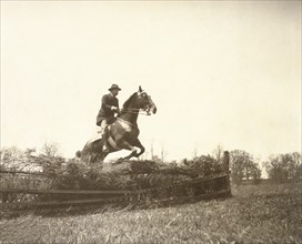 U.S. President Theodore Roosevelt on Horseback Jumping Fence, 1902
