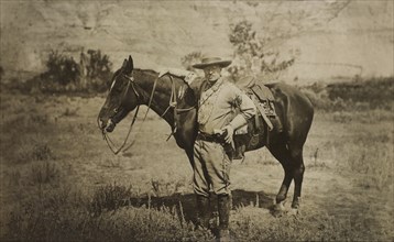 Full-Length Portrait of Theodore Roosevelt Standing Alongside Horse, Wearing Cowboy Outfit, Photograph by T.W. Ingersoll, 1910