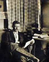 Theodore Roosevelt (1858-1919), 26th President of the United States 1901-09, Three-quarter Length Seated Portrait, Reading, Photograph by Waldon Fawcett, 1903