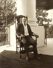 Theodore Roosevelt (1858-1919), 26th President of the United States 1901-09, Full-length Seated Portrait on Porch, Photograph by Conrad M. Gilbert, April 1904