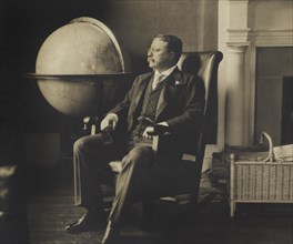 Theodore Roosevelt (1858-1919), 26th President of the United States 1901-09, Seated Portrait next to Globe, 1905