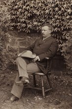 Theodore Roosevelt, Full-Length Portrait Seated in Chair Outdoor, August 1900