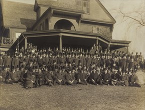 Ex-President Theodore Roosevelt (1st row, center). Sitting on Lawn of his Residence, Sagamore Hill, with a group of Men in Top Hats, Oyster Bay, New York, USA, March 31, 1909