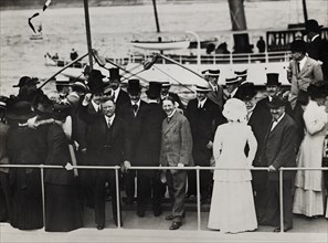 Former U.S. President Theodore Roosevelt, standing with group of people on boat upon his return from trip abroad, New York City, New York, USA, June 1910