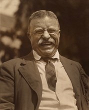 Half-Length Smiling Portrait of Former U.S. President Theodore Roosevelt at Home, Sagamore Hill, Cove Neck, New York, USA, Photograph by M.J. LeClerc, 1910
