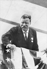 Former U.S. President Theodore Roosevelt leaning over Flag-Draped Railing during his Homecoming Reception after his trip abroad, New York City, New York, USA, June 1910