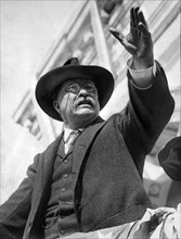 Theodore Roosevelt Reaching upwards as he speaks to Crowd from Flag-Draped Platform, Hackensack, New Jersey, USA, May 23, 1912