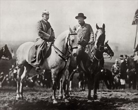 Former U.S. President Theodore Roosevelt and Kaiser Wilhelm II Riding on Horseback Attending Military Field Maneuvers with German Troops in Background, Doberitz, Germany, Photograph by Underwood & Und...