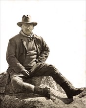 U.S. President Theodore Roosevelt, Full-Length Portrait Sitting on Large Stone, Glacier Point, Yosemite National Park, California, USA, Photograph by Underwood & Underwood, May 1903