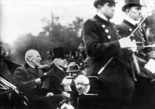 U.S. President Woodrow Wilson and French President Raymond Poincaré riding in open Carriage at beginning of Paris Peace Conference, Paris, France, Photograph by E. McConnell, December 14, 1918