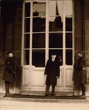 U.S. President Woodrow Wilson, full-length portrait, wearing top hat and overcoat, Attending Paris Peace Conference, Paris, France, Photograph by U.S. Army Signal Corps, January 1919